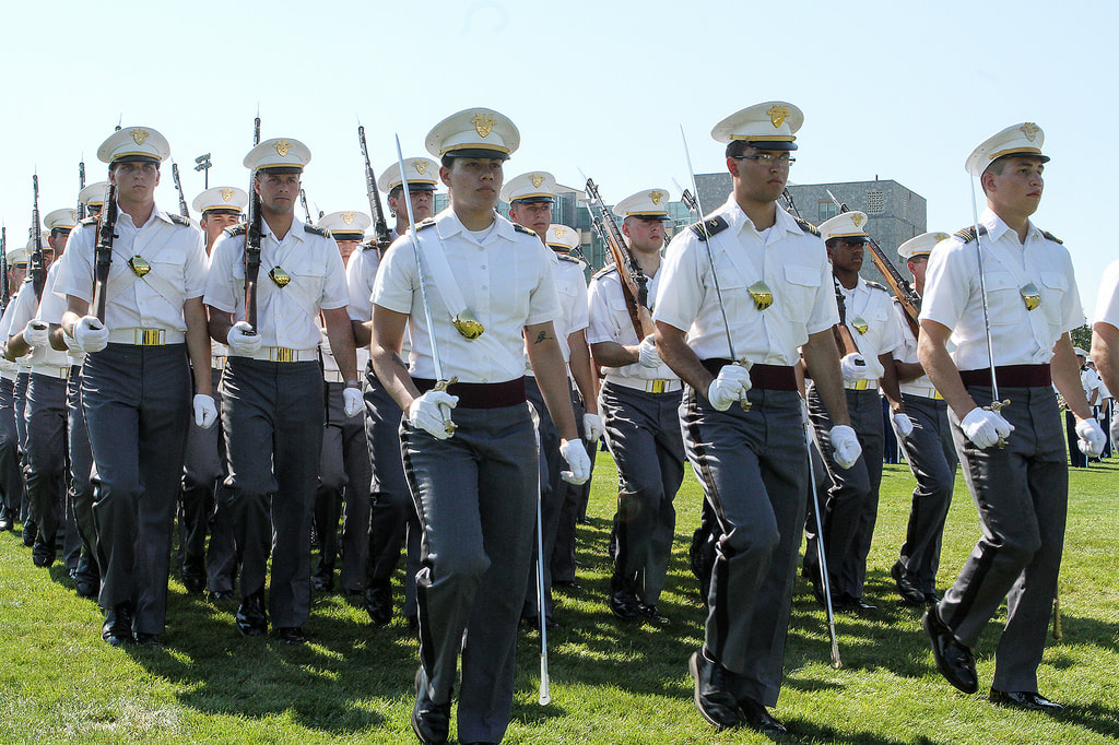West Point cadets marching with swords