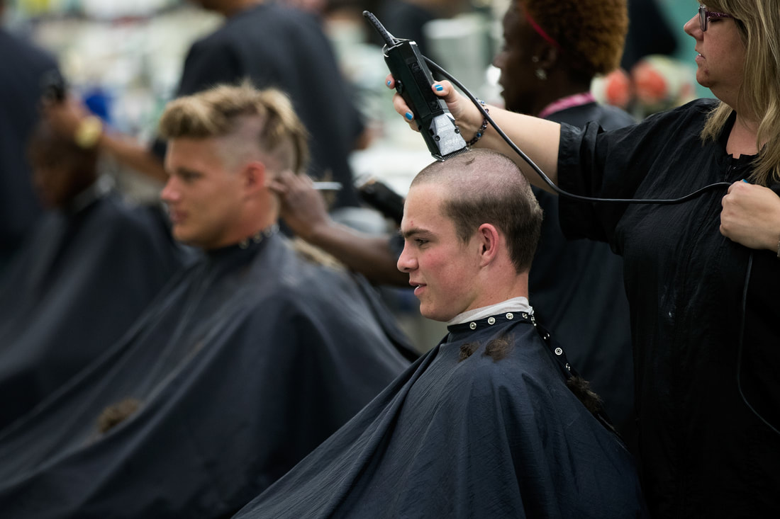 West Point cadet getting hair buzzed