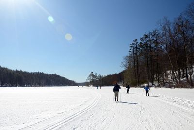 A small group cross country skiing