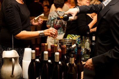 A group of people wine tasting